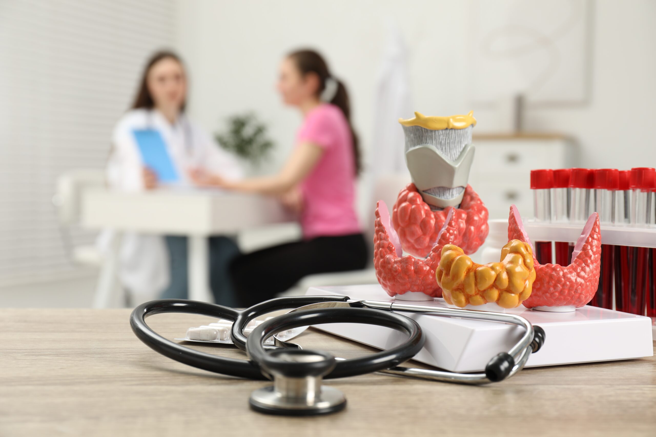 endocrinologist-examining-patient-at-clinic-focus